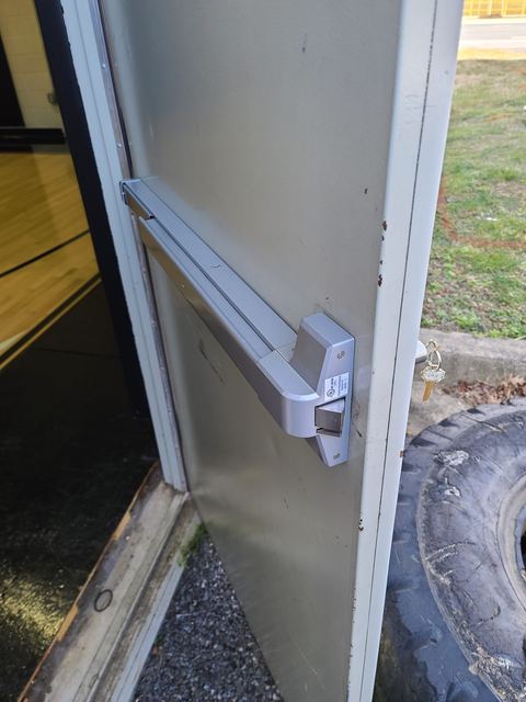 Close-up of a commercial panic bar exit device